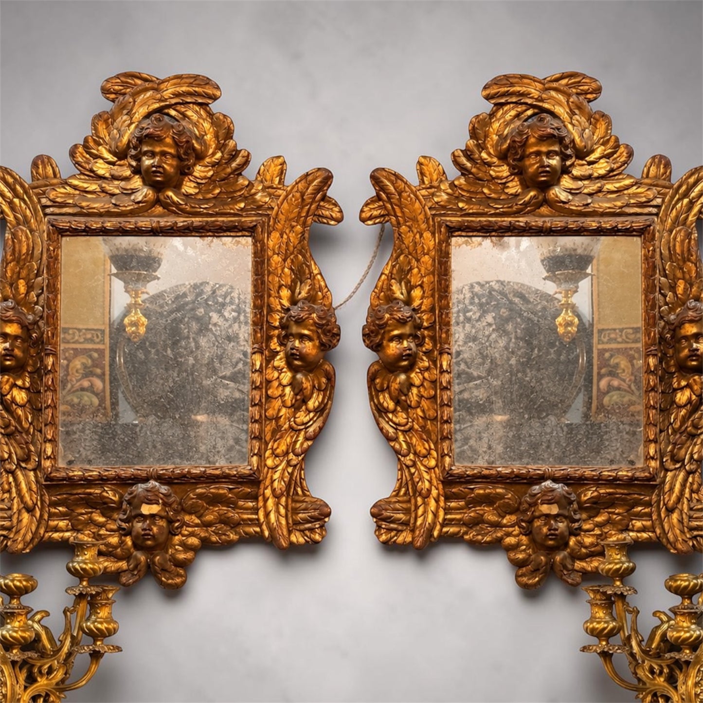 Pair of 19th Century Italian Giltwood Cherub Mirrors